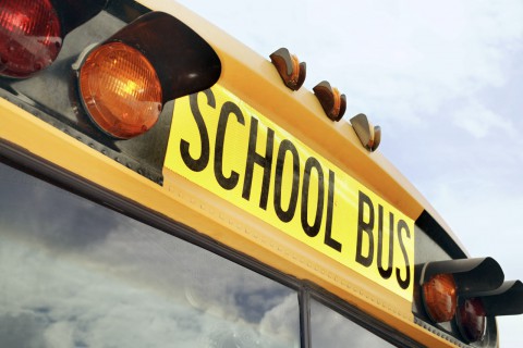 Clover, South Carolina, USA --- Flashing Lights and Sign on School Bus --- Image by © Royalty-Free/Corbis