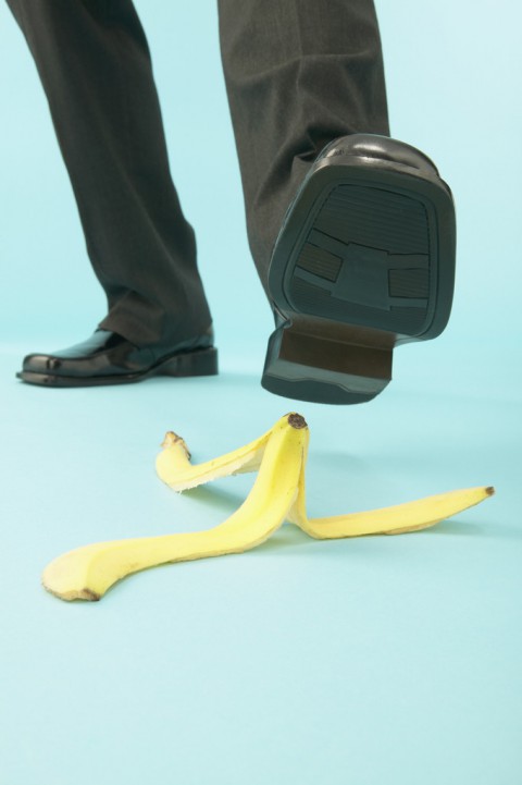 Businessman Stepping on Banana Peel